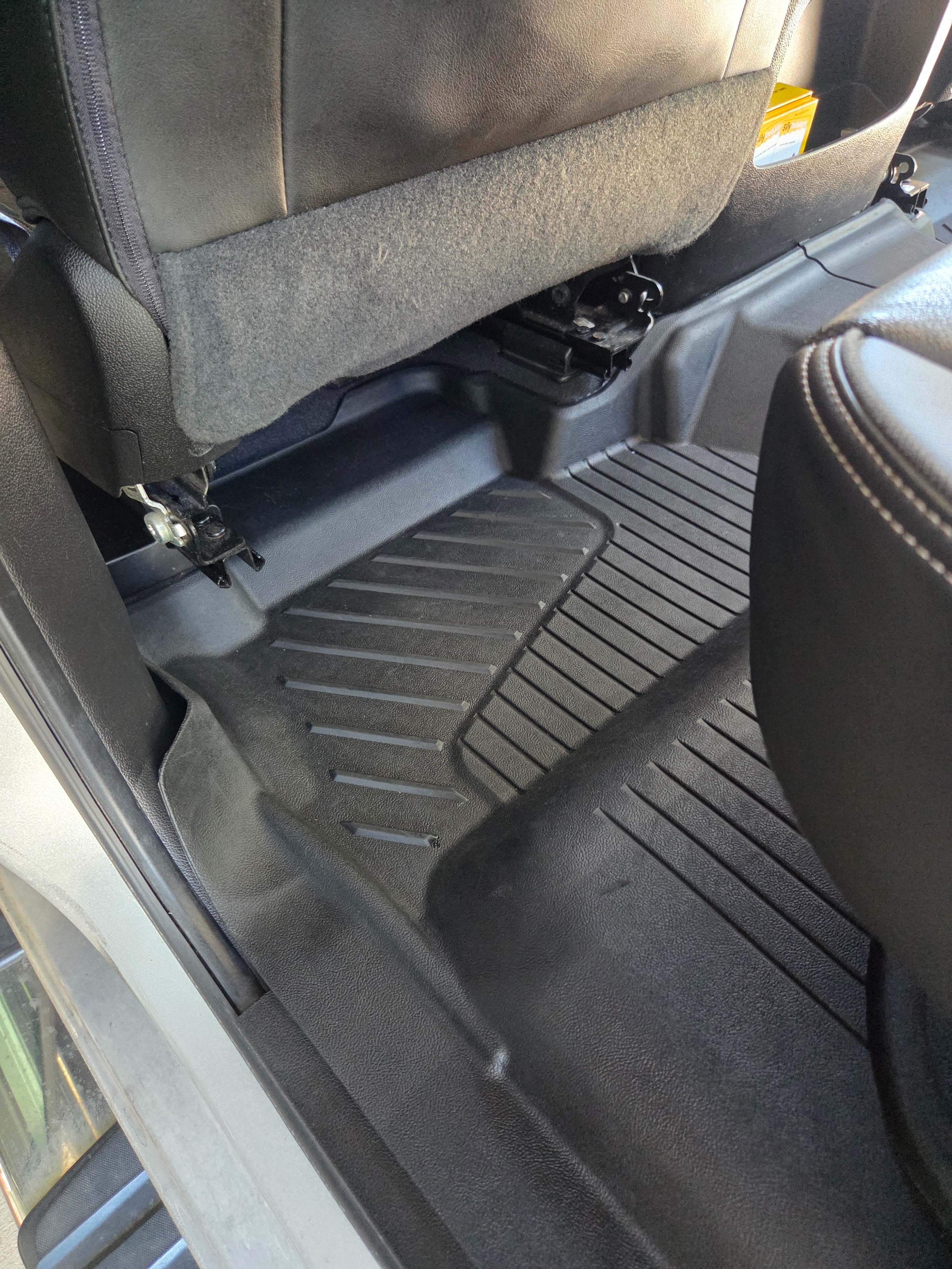 Clean GMC truck rear floor mat after interior detailing