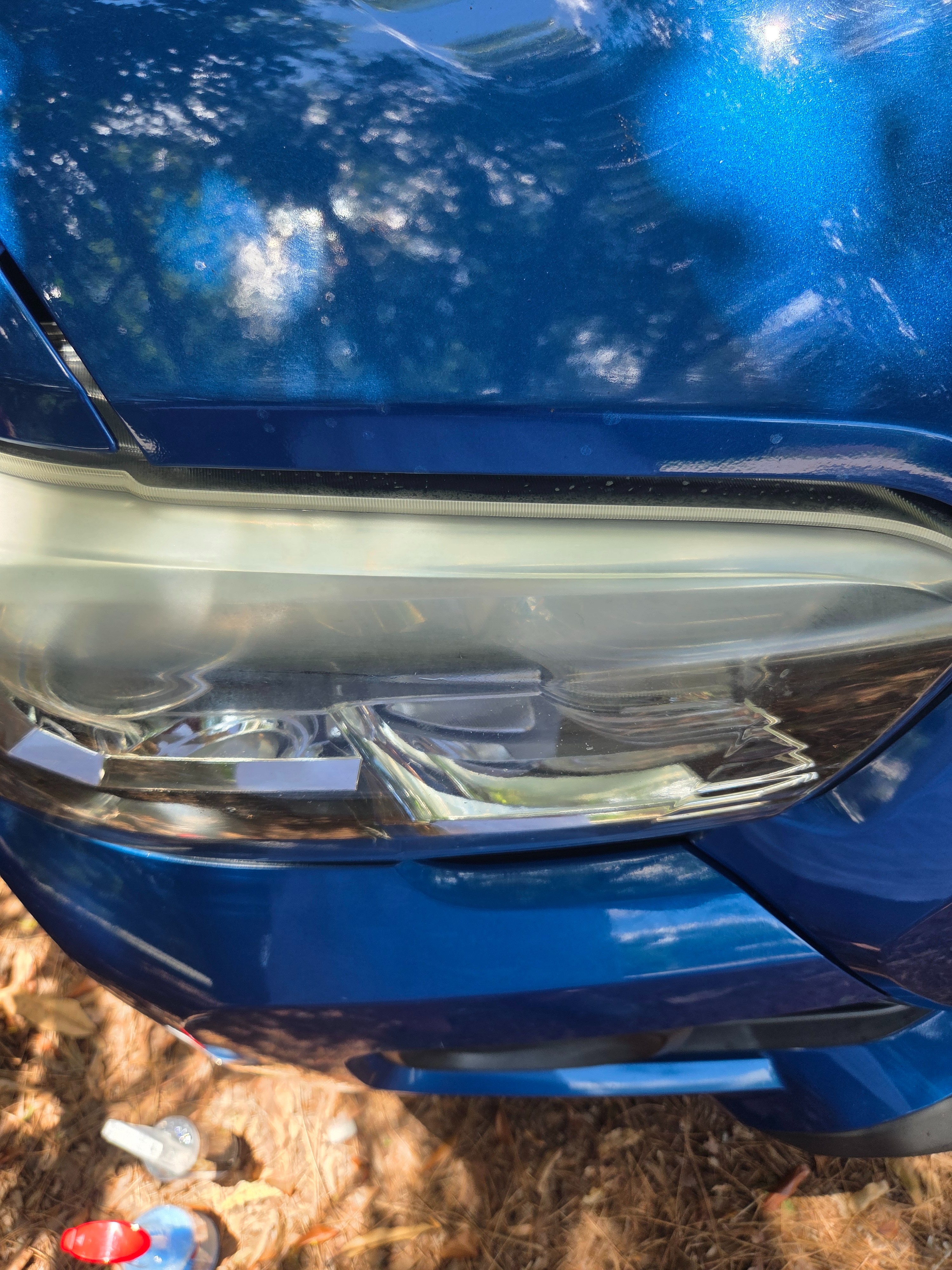 Foggy, oxidized headlight before restoration, angle 1