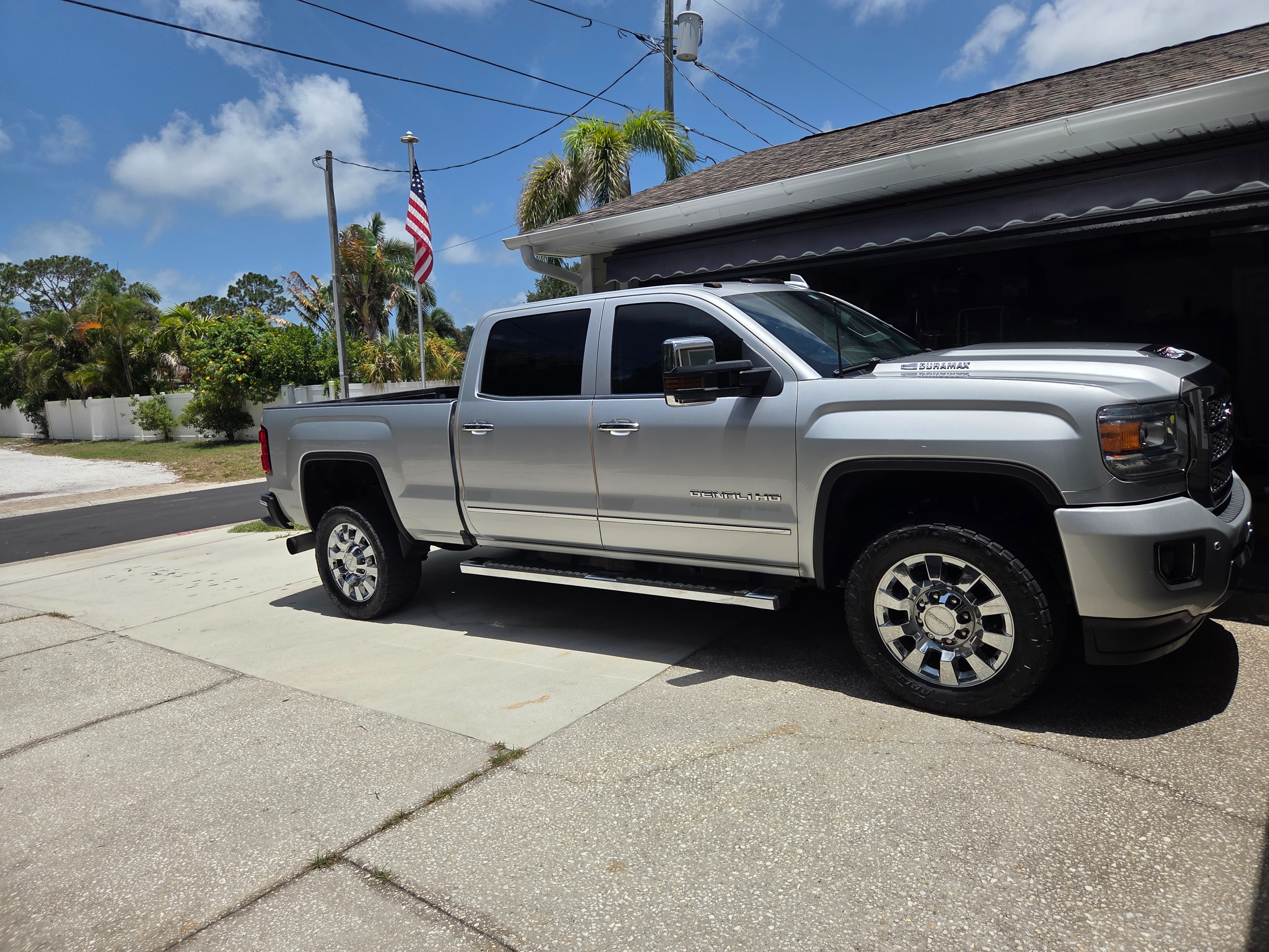 Clean glossy silver GMC truck exterior after a complete detail